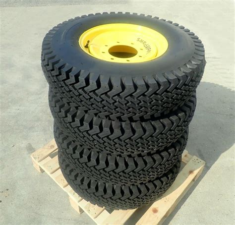 skid steer rims with nonremovee tires|skid steer loader wheels.